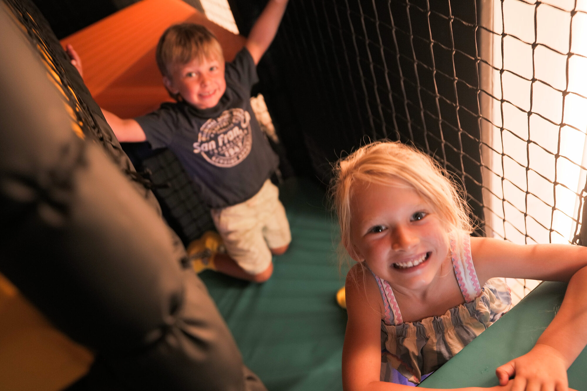 Two children playing together in the Yo Coast soft play